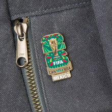 Enamel lapel pin featuring FIFA logo and Mexico label on gray fabric