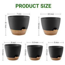 Black self-watering plant pot with speckled tan reservoir base and drainage opening