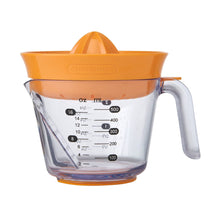 Orange citrus juicer with clear measuring pitcher, handle, and visible reamer cone