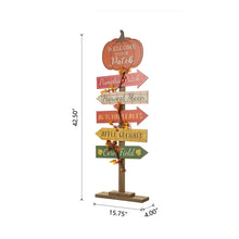 Wooden pumpkin patch sign with pumpkin-shaped top and hanging colorful arrow plaques