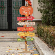 Tall wooden pumpkin patch sign with stacked fall arrow placards and pumpkin topper