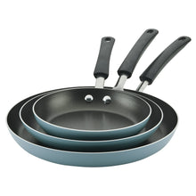 Stack of aqua nonstick frying pans with black handles and circular cooking surfaces