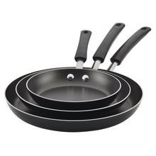 Nested black nonstick frying pans set with black handles and riveted bases