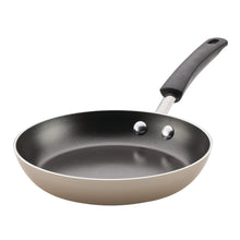 Champagne nonstick frying pan with black handle and two rivets
