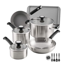 Stainless steel cookware set with pots, pans, and matching lids