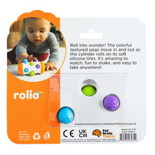 Sensory roller rattle toy package with orange panel, child photo, and peg detail window
