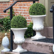 Pair of faux boxwood round topiary balls in white urn planters on pedestal