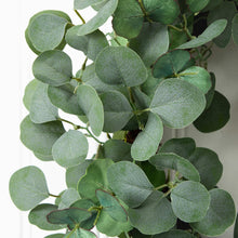 Faux eucalyptus wreath leaves: textured green oval foliage on branching stems.