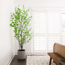 Faux enkianthus tree with green leaves in a gray planter pot