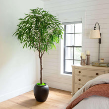 Faux willow tree in a dark pot with green leaves and a brown trunk