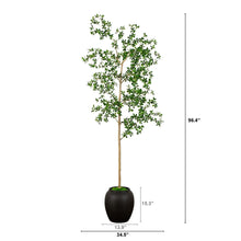 Faux quince tree with green leaves on a light wood trunk, set in dark planter