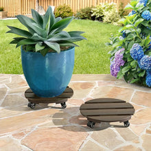 Two dark-brown slatted plant caddies with caster wheels under blue planters