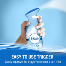 Febreze Air Effects air freshener spray bottle held with trigger for soft mist