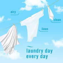 Febreze Air Effects air freshener spray ad with white laundry on a clothesline