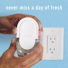 Air freshener scent control plug held in hands