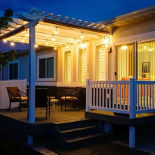 LED string lights with warm glowing bulbs on porch pergola with dark cord