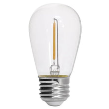 Clear LED filament light bulb with metal screw base and warm glow