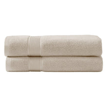 Cream bath towel set, two neatly folded terry towels with ribbed banding detail