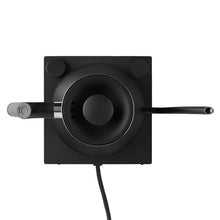 Black electric kettle top view with circular lid and side spout
