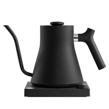 Black electric gooseneck kettle with handle and spout, on base