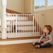 White baby pet gate installed at stairs with vertical bars and latch