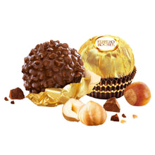 Ferrero Rocher milk chocolate hazelnut candies with broken pieces and nuts