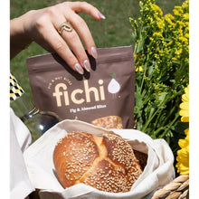 Fig and almond bites pouch with sesame seed bread rolls