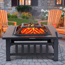 Black wood-burning fire pit table with open screen lid and flames on the cooking pan