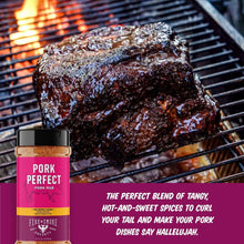 Pork rub seasoning bottle with pink label beside grilled pork on a BBQ grate