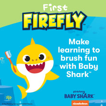 Baby Shark light-up training toothbrush, yellow character handle with suction base.