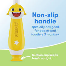 Baby Shark light-up training toothbrush with non-slip handle and suction cup base.