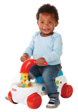 Kids ride-on popper with red cab, blue top, white base and colorful balls