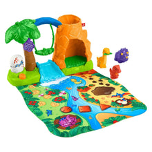Dinosaur village play mat with green palm tree, orange cave, blue stream, and 3 figures