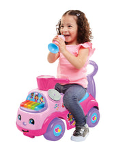 Kids push ride-on car in pink and purple with smiling face and light-up music panel