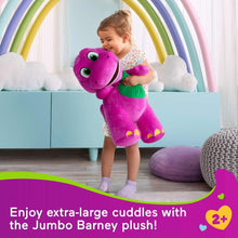 Jumbo purple plush dinosaur with green belly, held up by a child