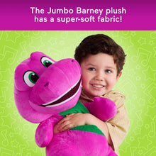 Purple plush dinosaur face with green belly, held close by a smiling child