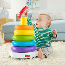 Colorful stacking toy with rainbow rings and clear dome, on a white base