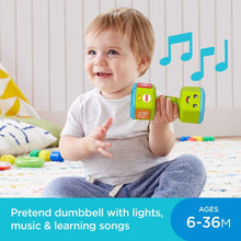 Green musical dumbbell rattle toy with lighted cube end, held by smiling baby