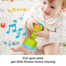 Green musical baby dumbbell rattle toy with lighted number panel, held by baby