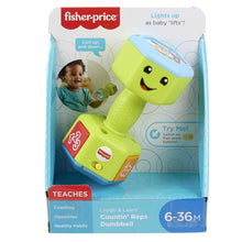 Green musical baby dumbbell rattle toy in retail box, face and number panels visible