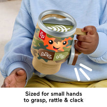 Camo learning coffee mug toy held by a child with ABC/123 buttons and side handle