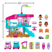 Beach house playset with teal tower, wave slide, mini furniture, and included figures
