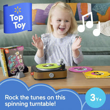 Toddler record player toy with green spinning turntable and musical arm