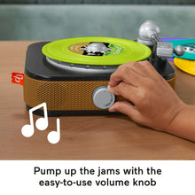 Toddler record player toy with green turntable record and volume knob