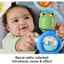 Sensory high chair toy with green frog roller and clear ball on blue base