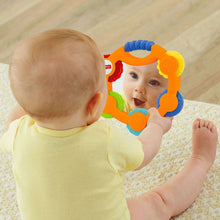 Baby tambourine toy in use, held near a child’s face