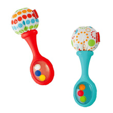 Two maracas toys with red and teal handles and patterned round heads