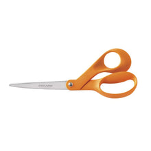 Fiskars orange-handled scissors with silver blades and oval finger loops, isolated.