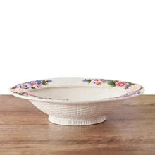 White ceramic centerpiece bowl with colorful flower border and pedestal stand