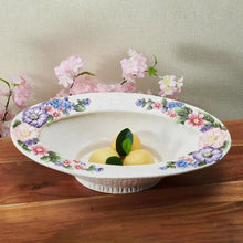 White ceramic centerpiece bowl with floral rim and scalloped pedestal base